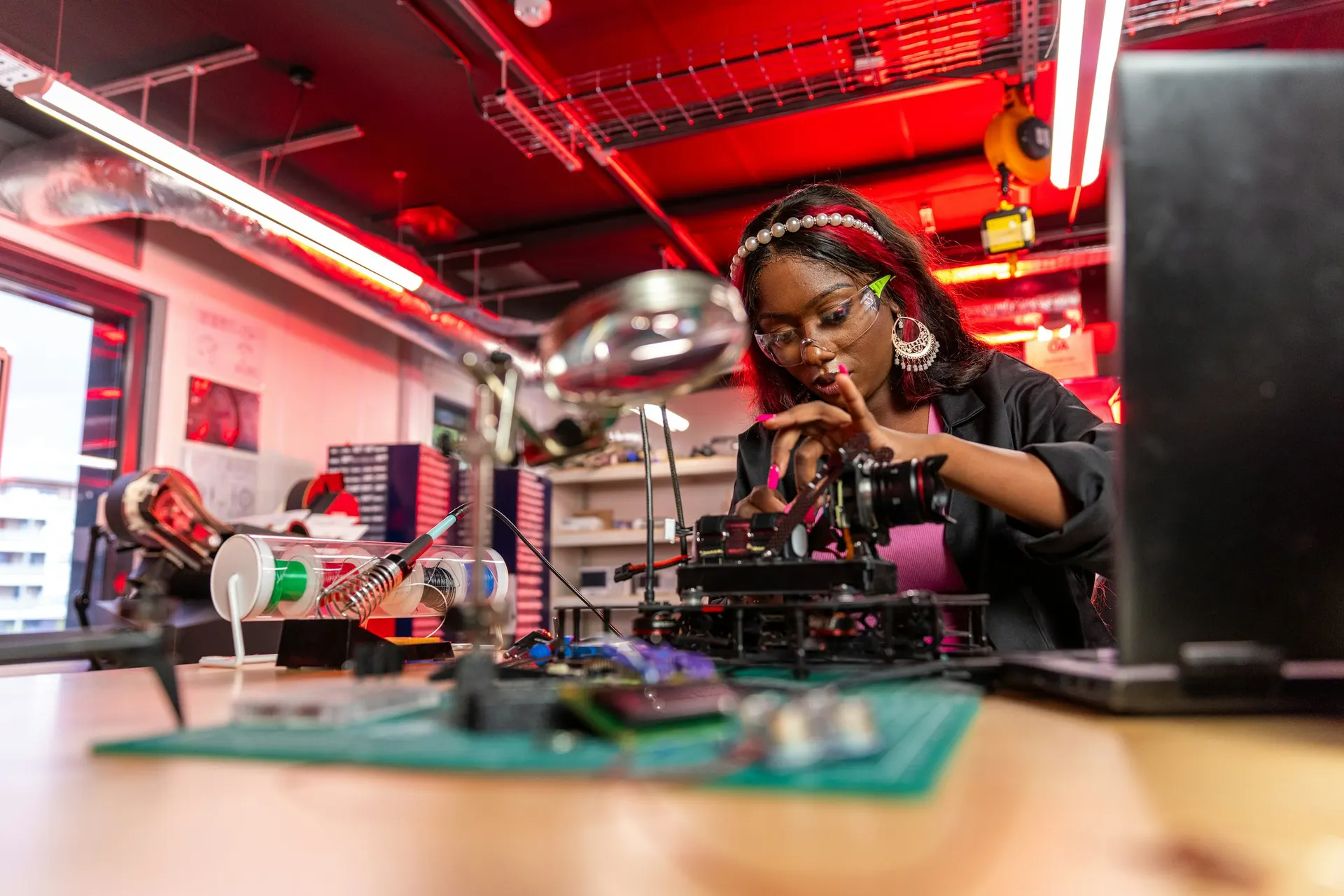 Student assembling an electronics project in a lab