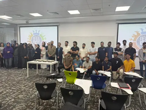 Students and faculty gathered in a classroom for the IEEE Day 2025 celebration